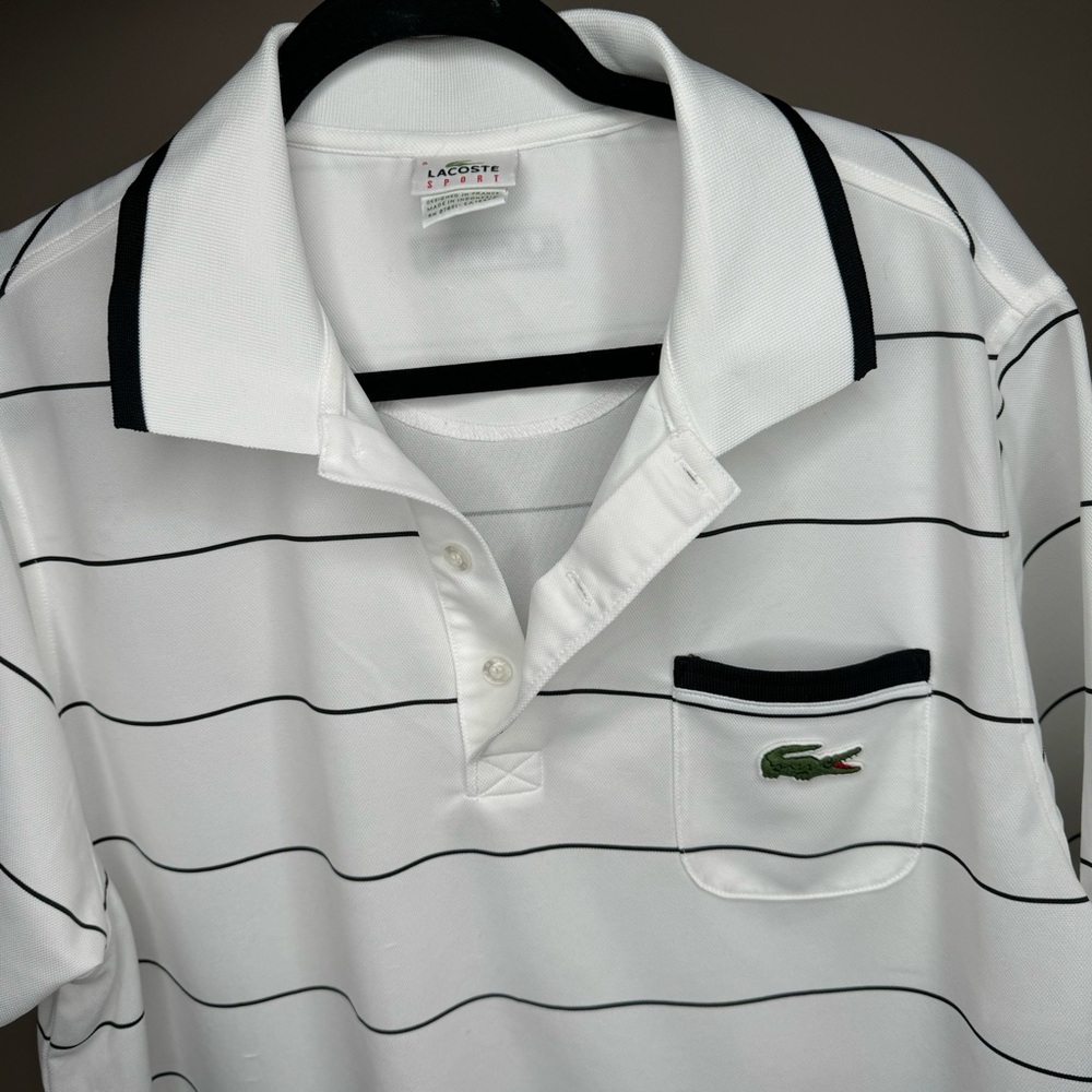 Lacoste polo shirt men size 8 large alligator on the front pocket.